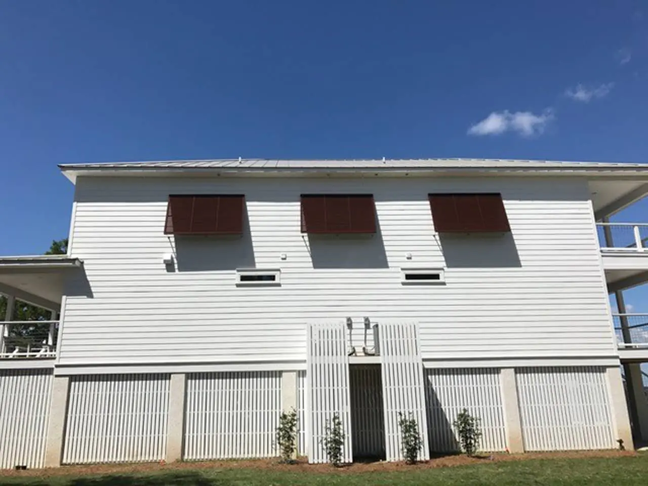 Burgandy Bahama shutters on a house