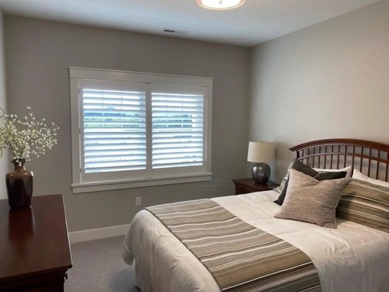 Classic Wood shutters in a bedroom