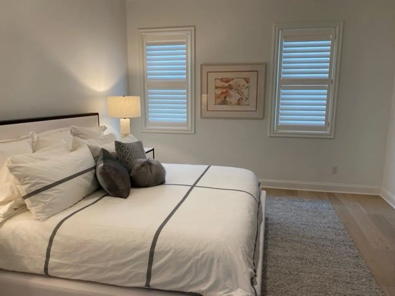 Faux wood shutters in a bedroom