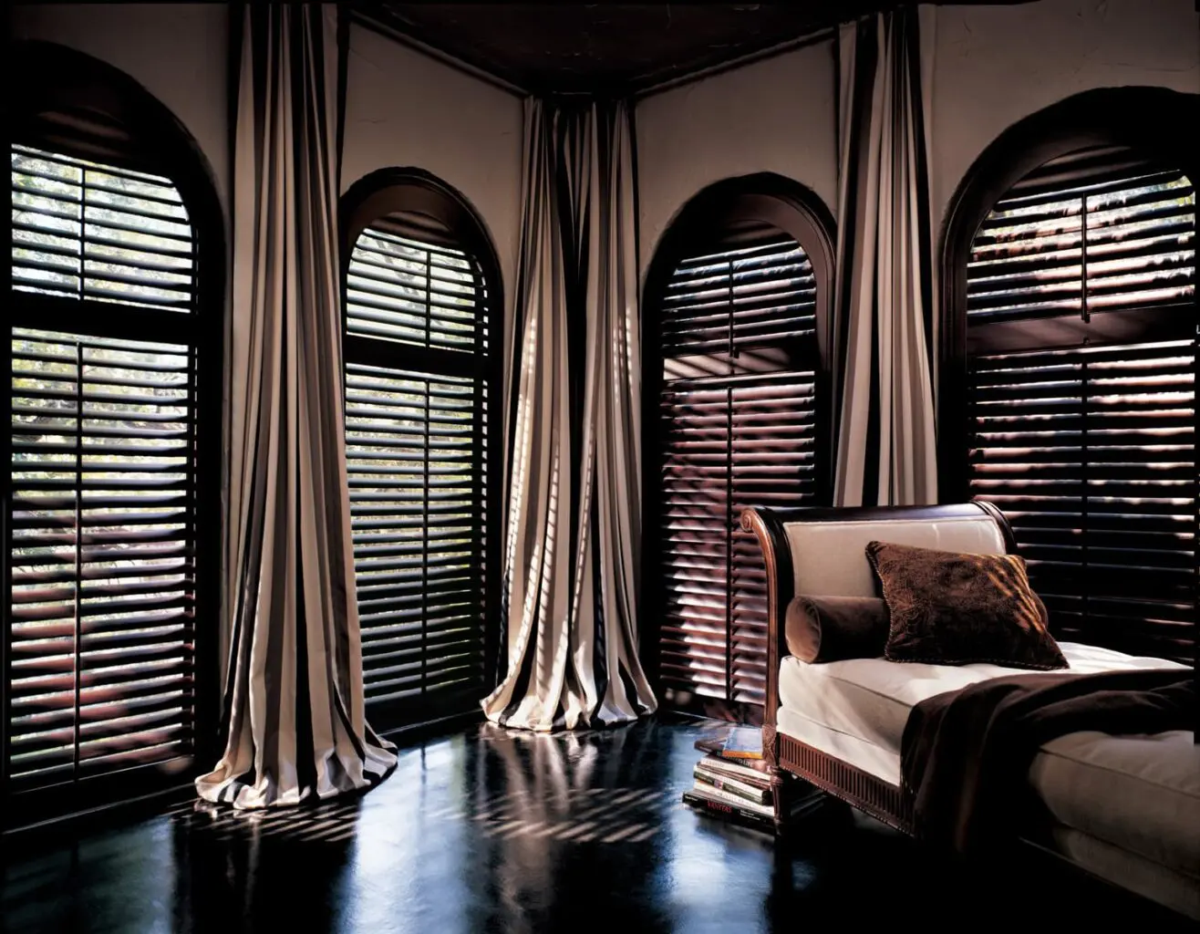 Heritance® Wood Shutters on tall, arched windows