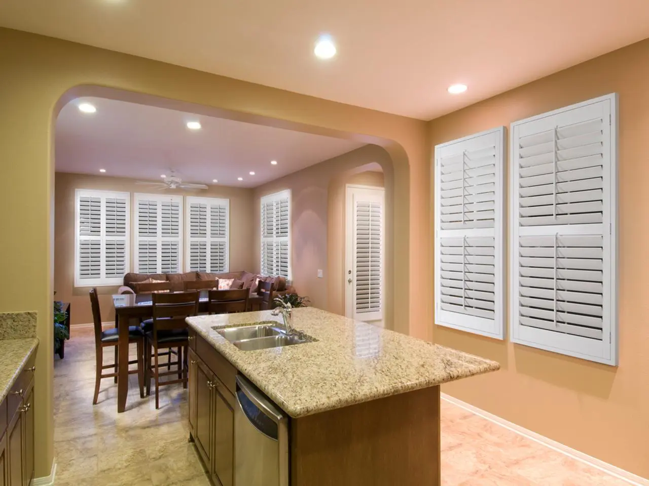 Open kitchen dining room with interior shutters
