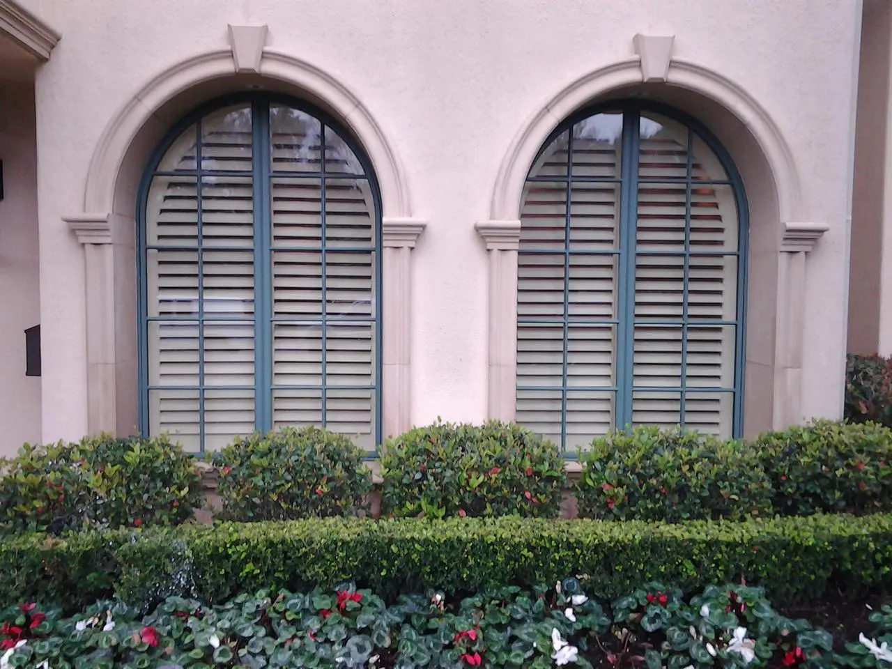Exterior view of arched shutters