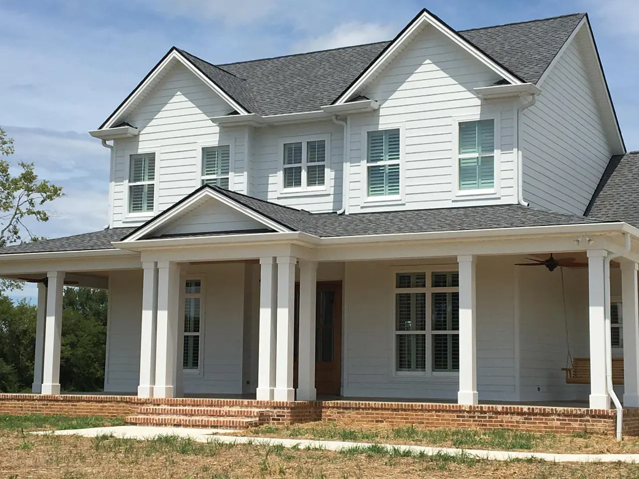 Home with view from outside of plantation shutters on the windows