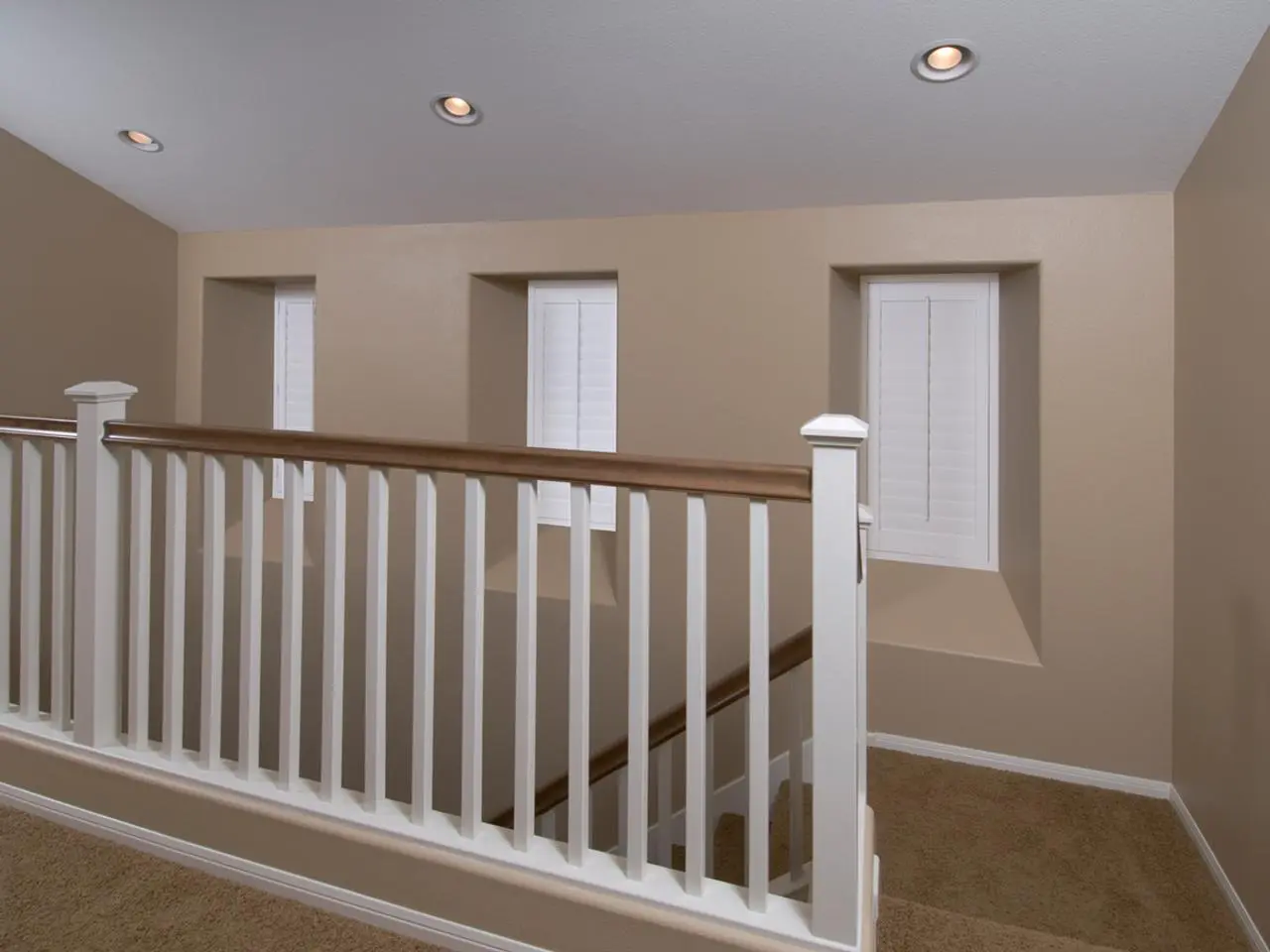 Interior shutters in an alcove by stairs
