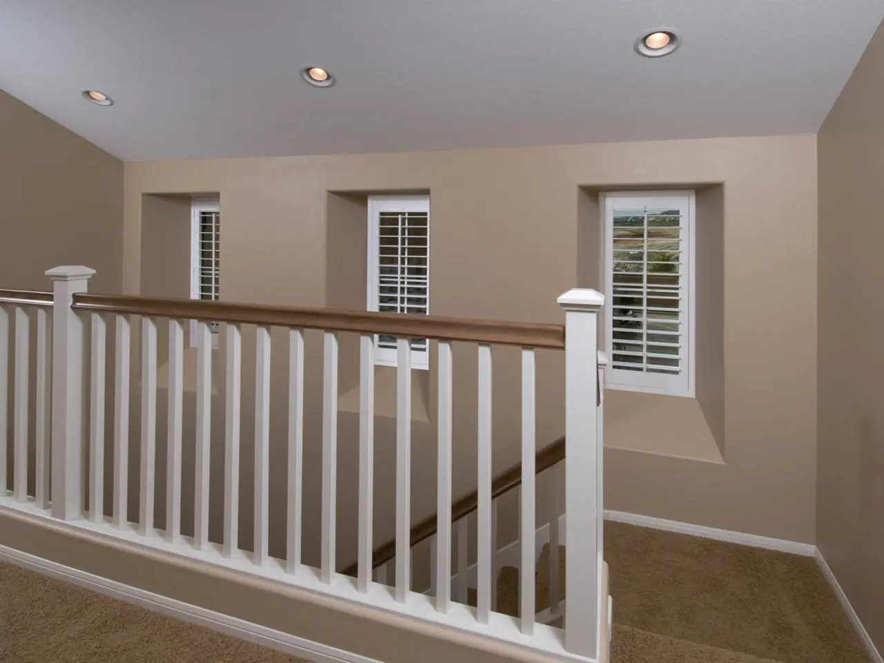 Interior shutters by stairs