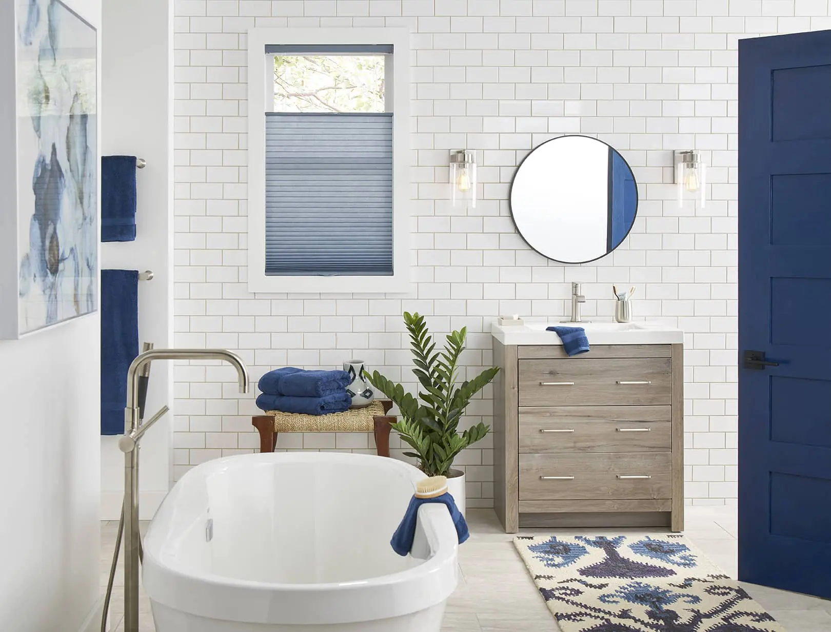blue blinds matching accent color in a white bathroom