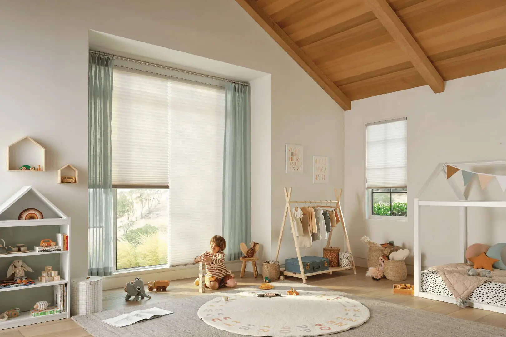 child playing in bedroom with cordless honeycomb shades