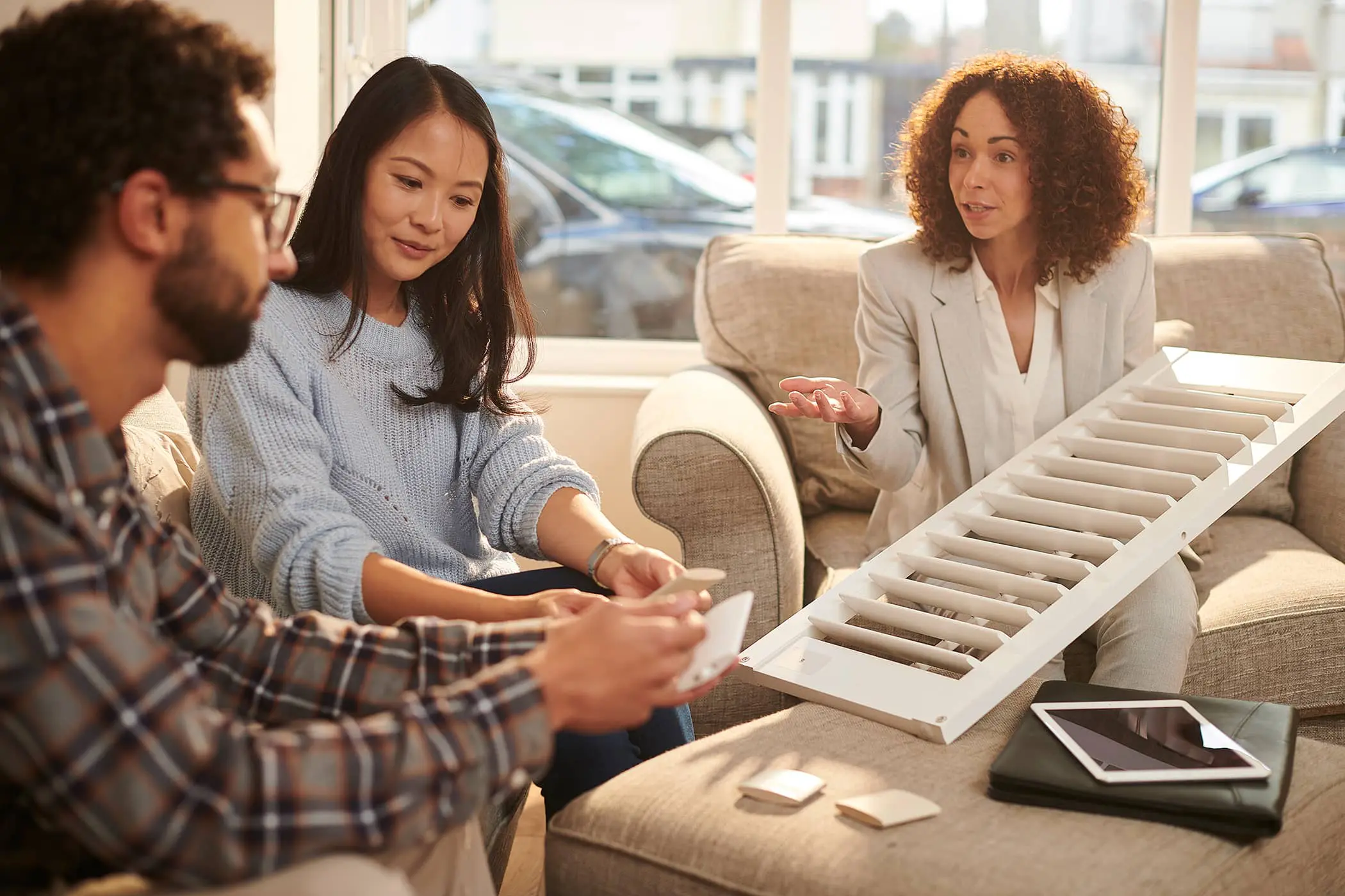 designer demonstrating wood shutters