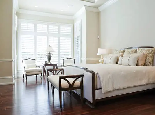 interior shutters in a master bedroom