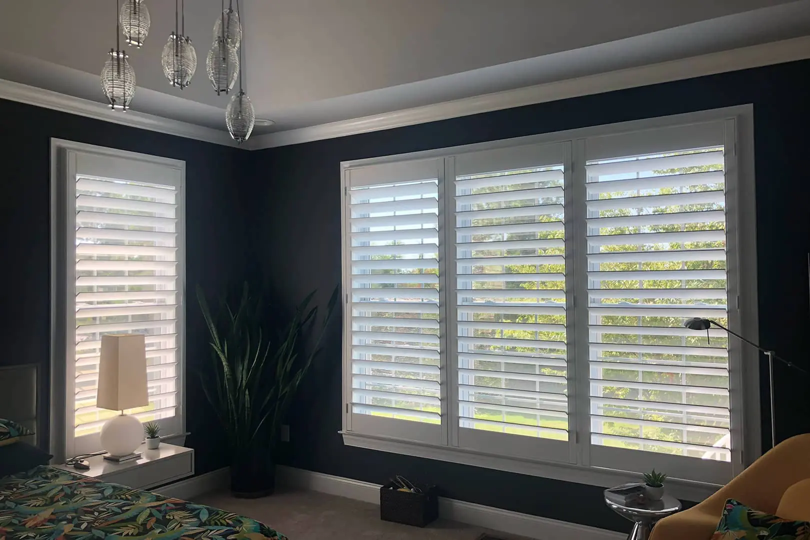 outside-mount plantation shutters on 2 large bedroom windows