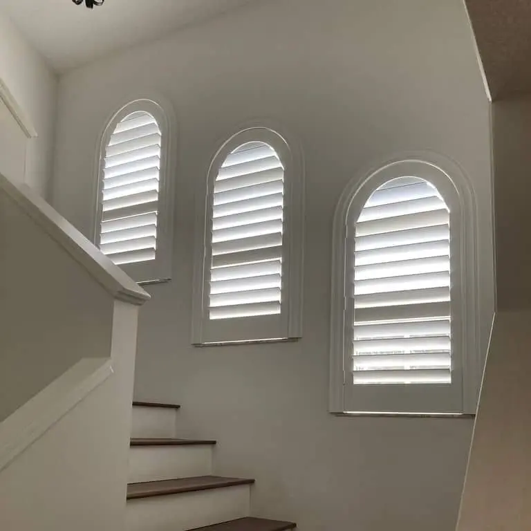 plantation shutters on 3 arch-top windows
