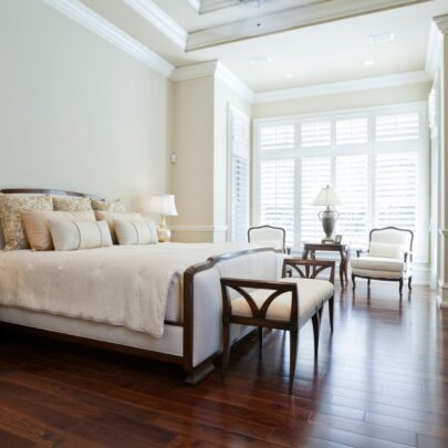 plantation shutters on arched window in sitting room