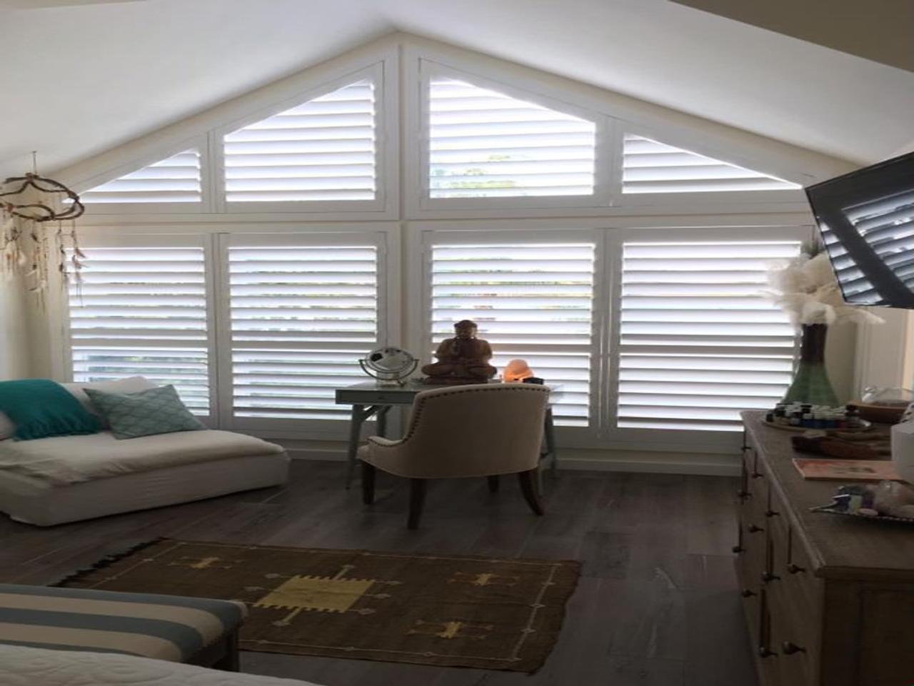 Big specialty shaped windows with Louverwood shutters