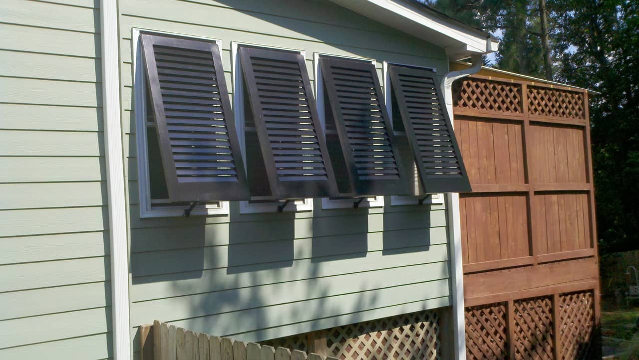 Bahama shutters on a framed house