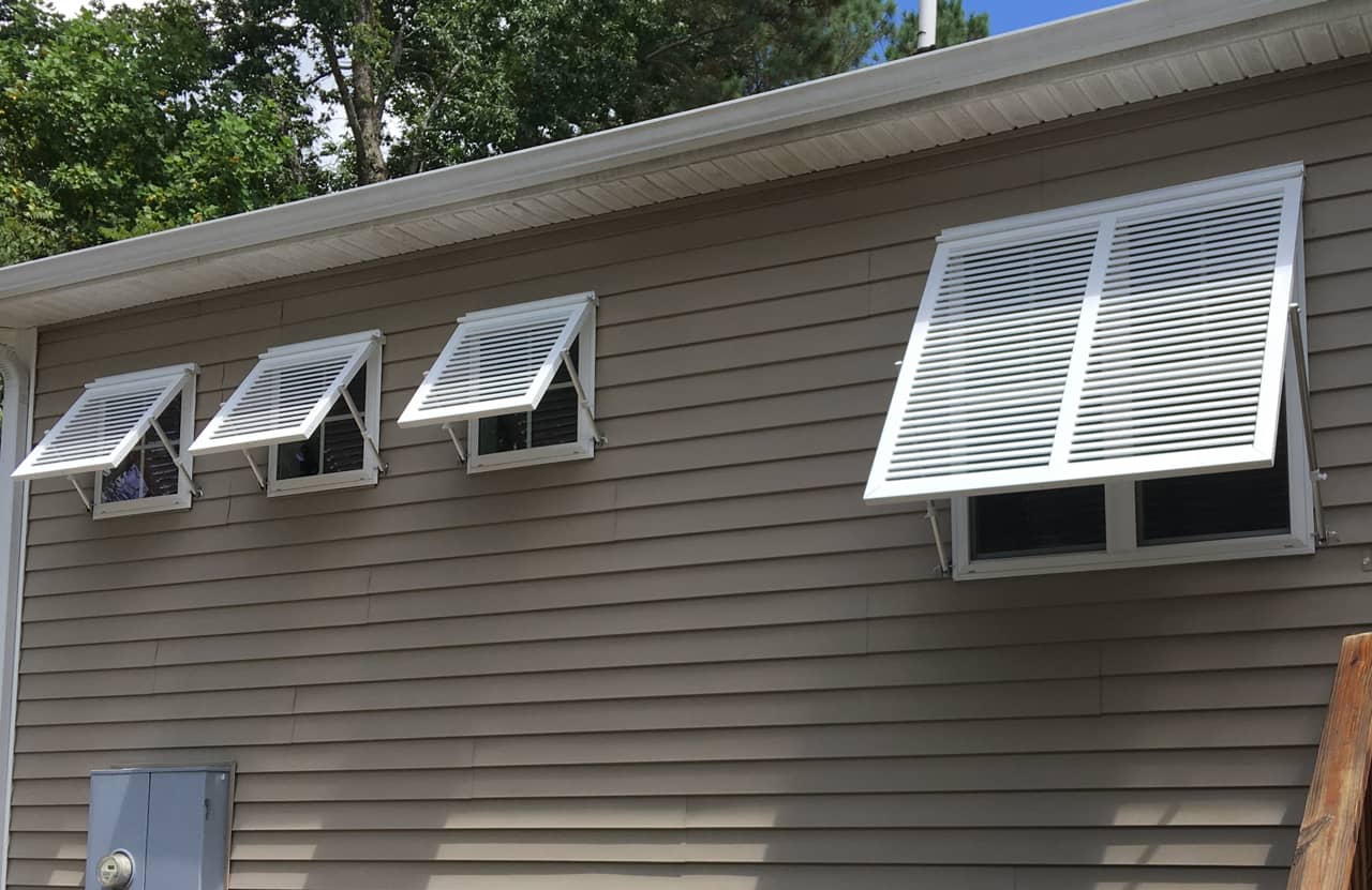 White Bahama shutters on a house