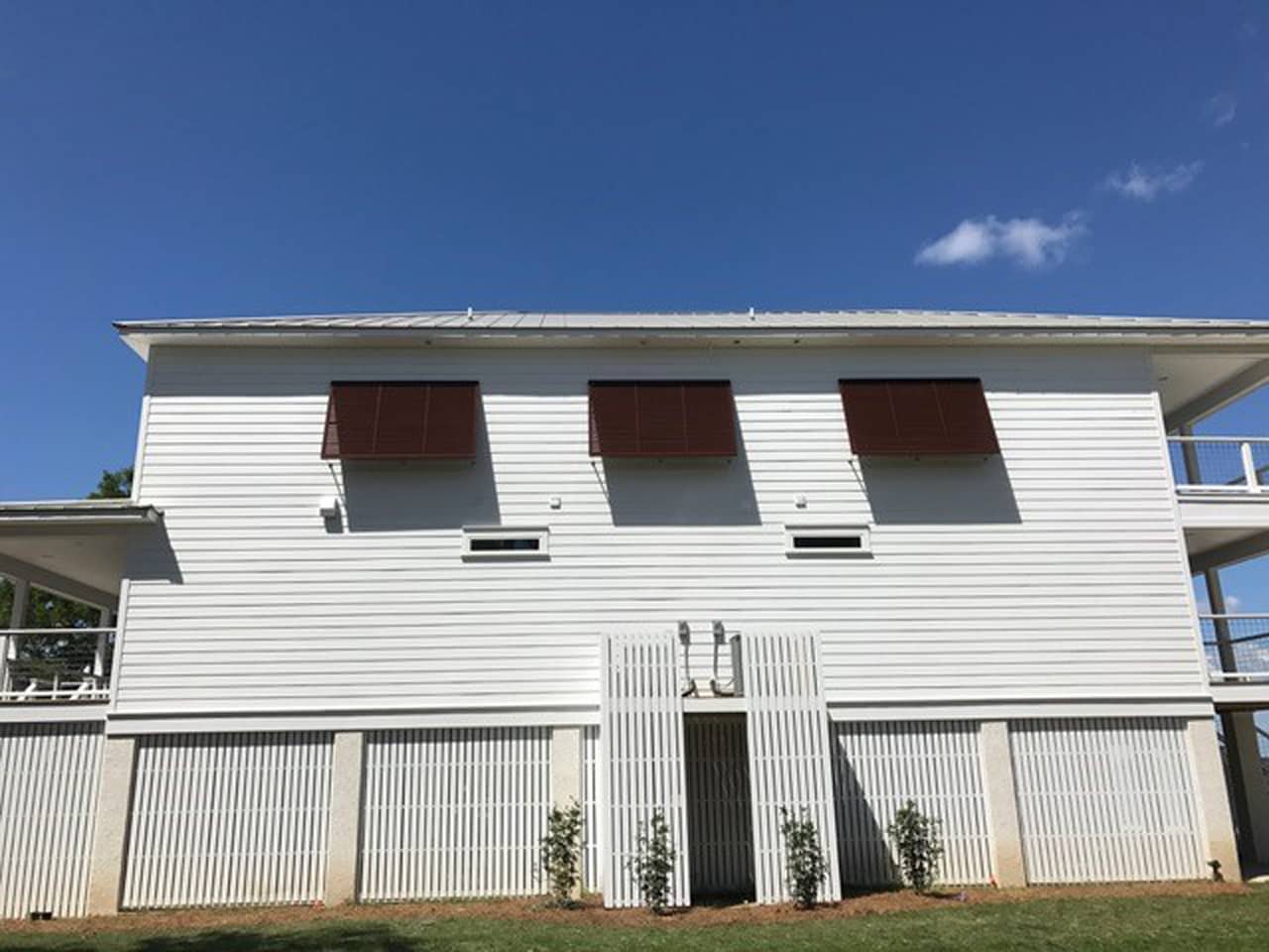 Burgandy Bahama shutters on a house