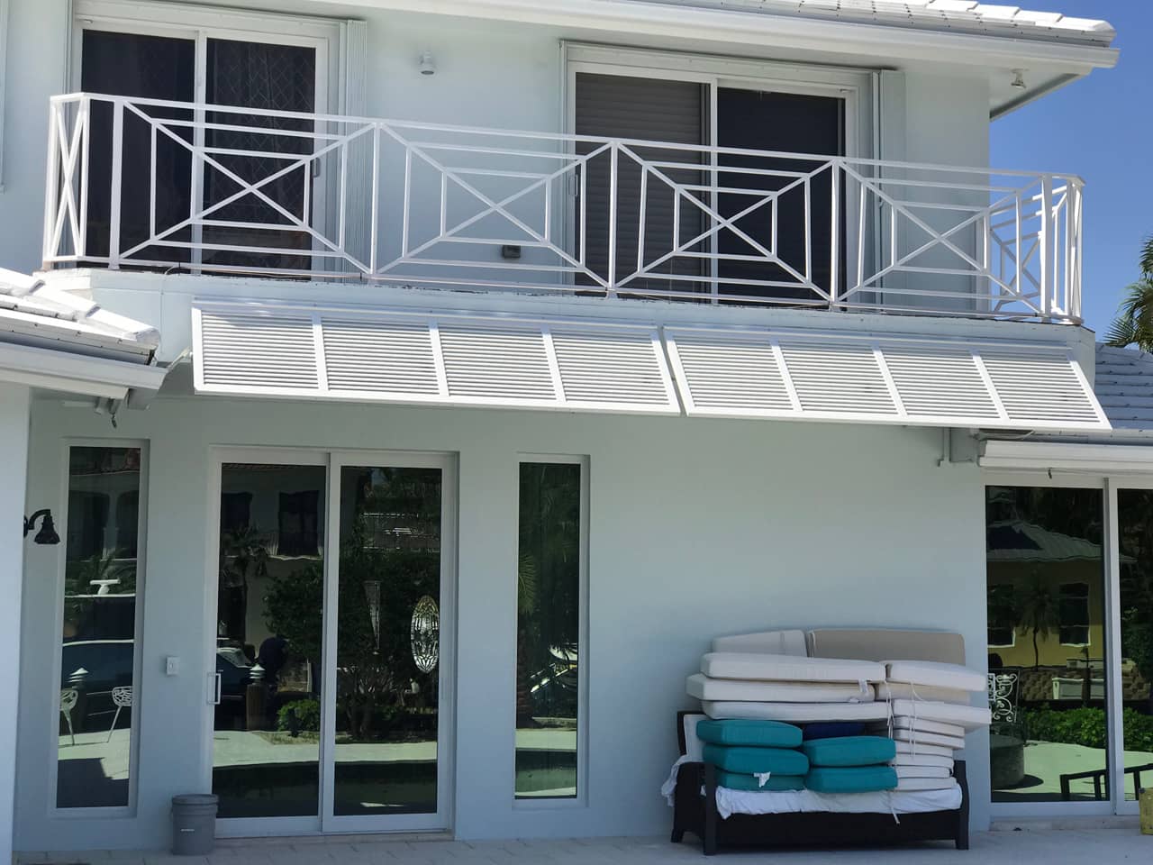 Bahama shutters shading patio