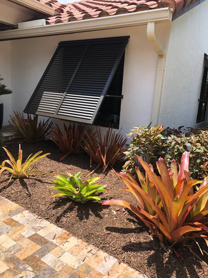 mediterranean style house with Bahama shutters