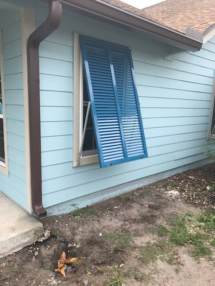 Bright blue Bahama shutters on a house
