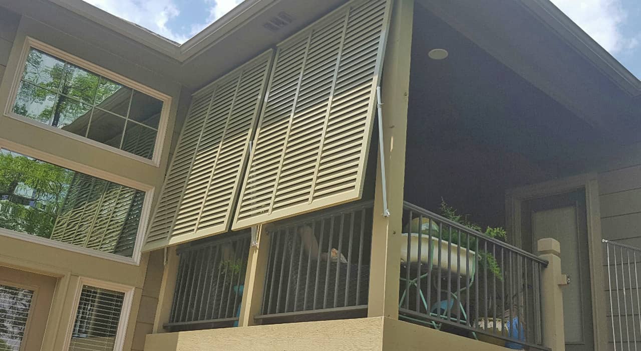 Bahama style shutters on a house