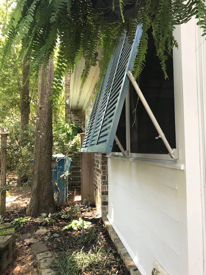 Bahama style shutters on a house