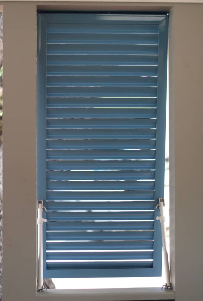 Blue Bahama shutters inside view