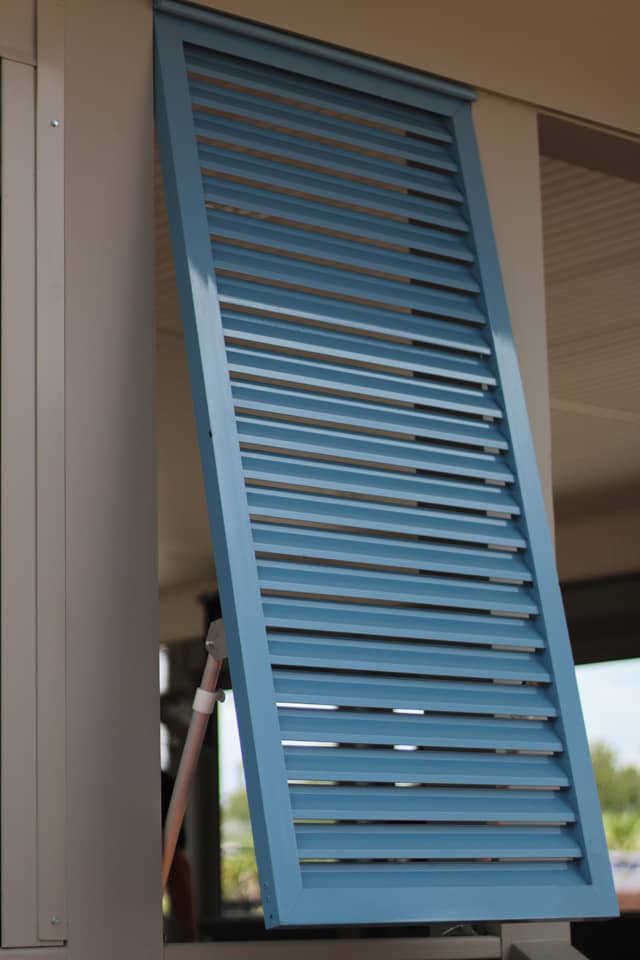 Blue Bahama shutters outside view