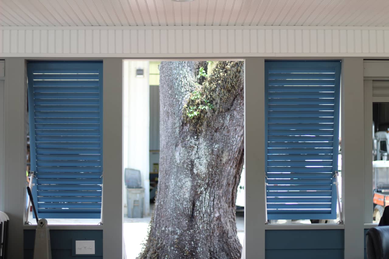 Pair of Bahama shutters on a house