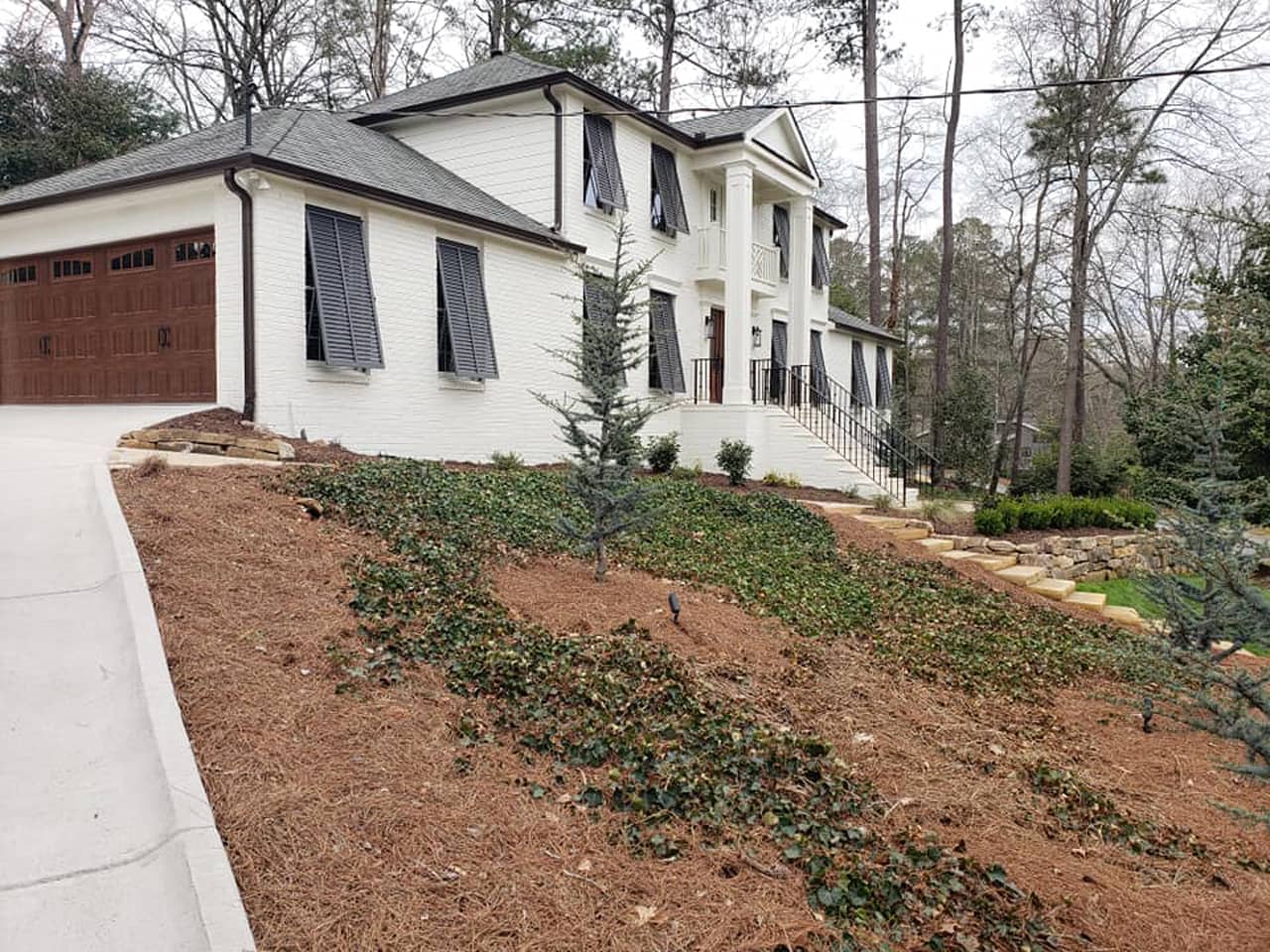 Bahama shutters on house with columns