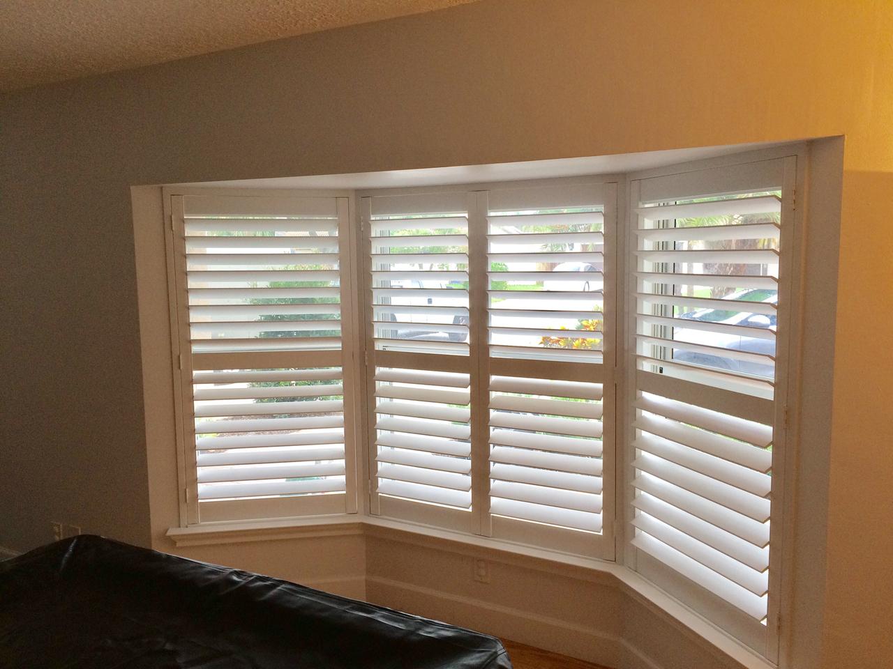 hidden tilt rod interior shutters on bay window