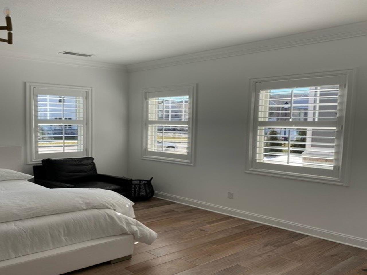 Interior shutters in bedroom