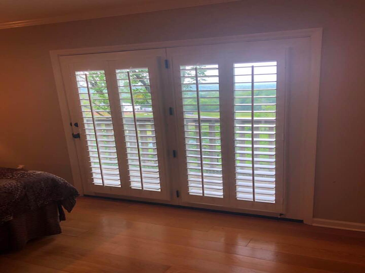 interior shutters on bedroom windows