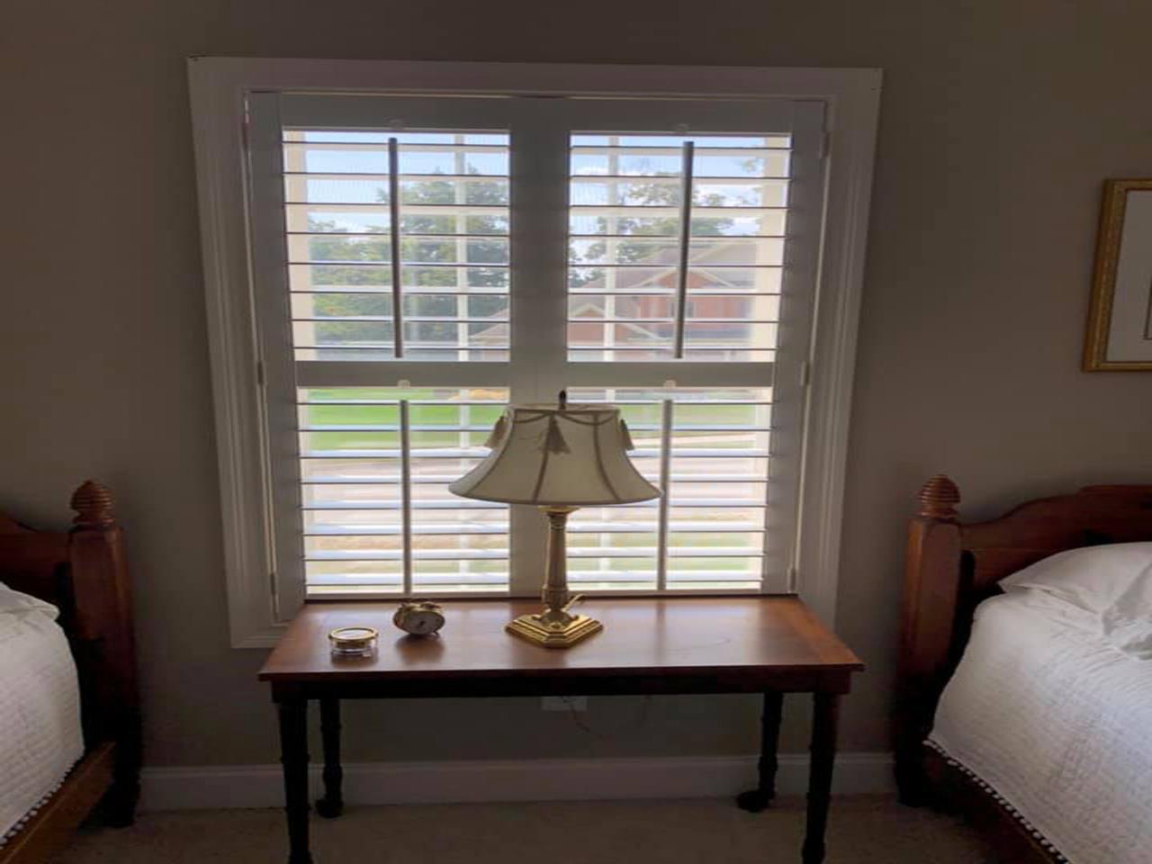 interior shutters on bedroom windows