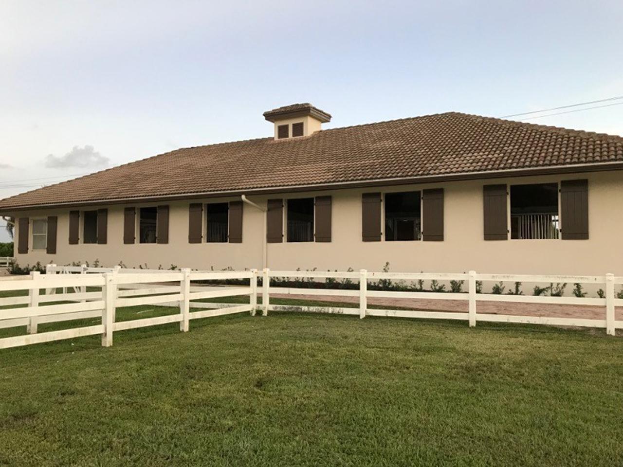 Board and batten shutters on a horse barn