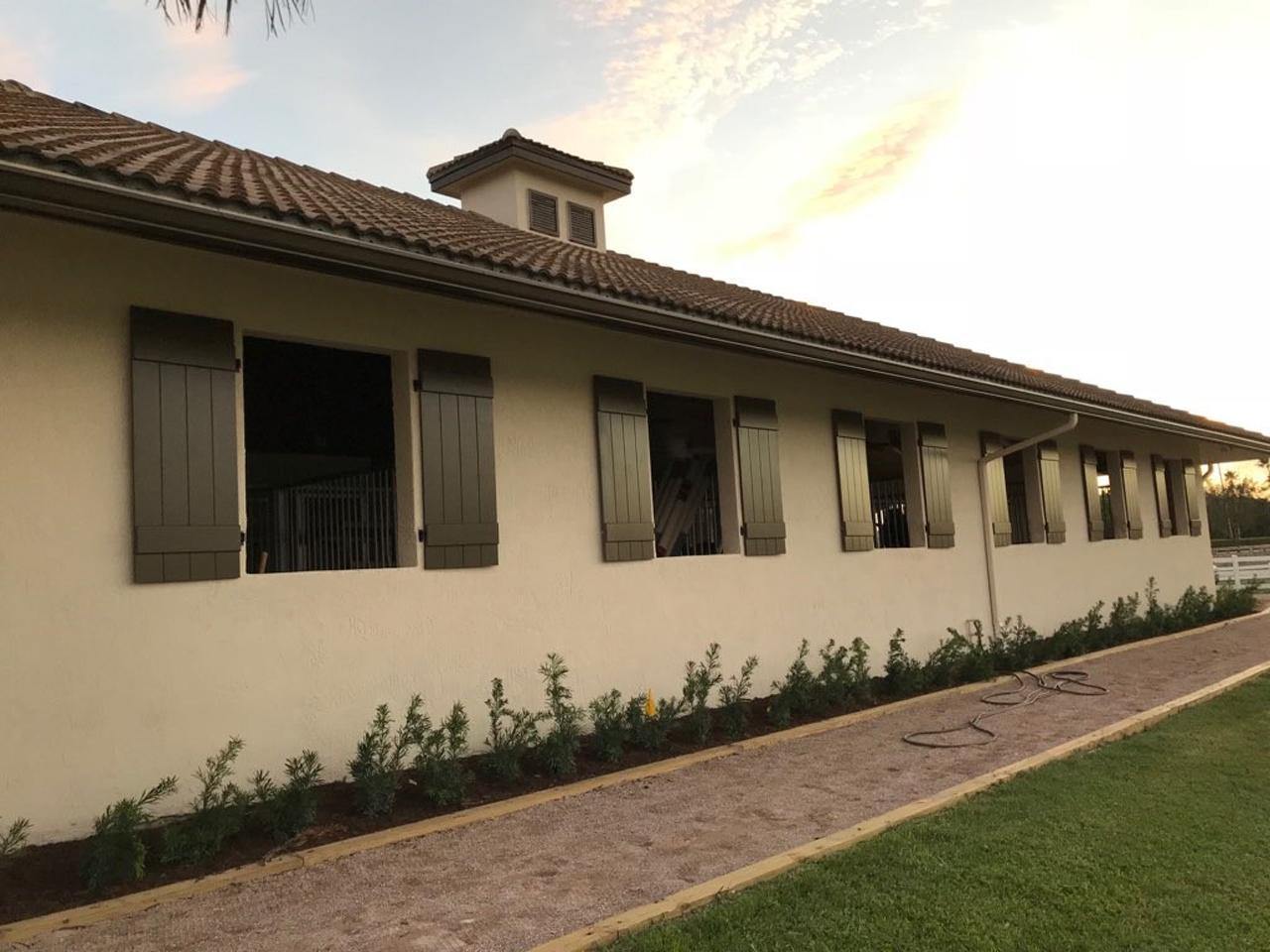 Board and batten shutters on a horse barn