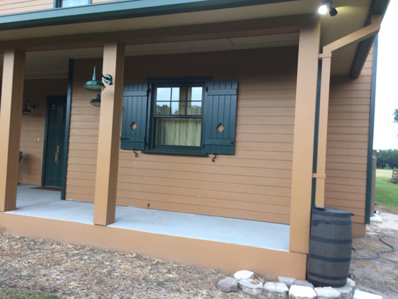 Porch with operable board and batten shutters
