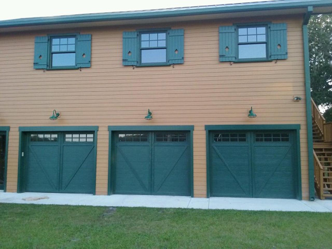 Board and batten shutters over the garage on a house