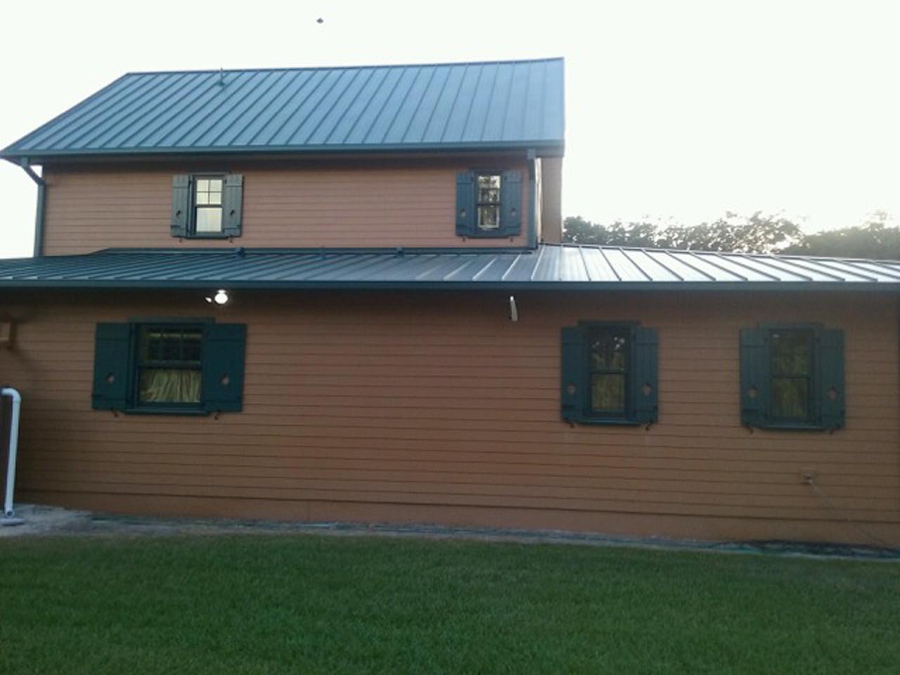 Side of house with board and batten shutters