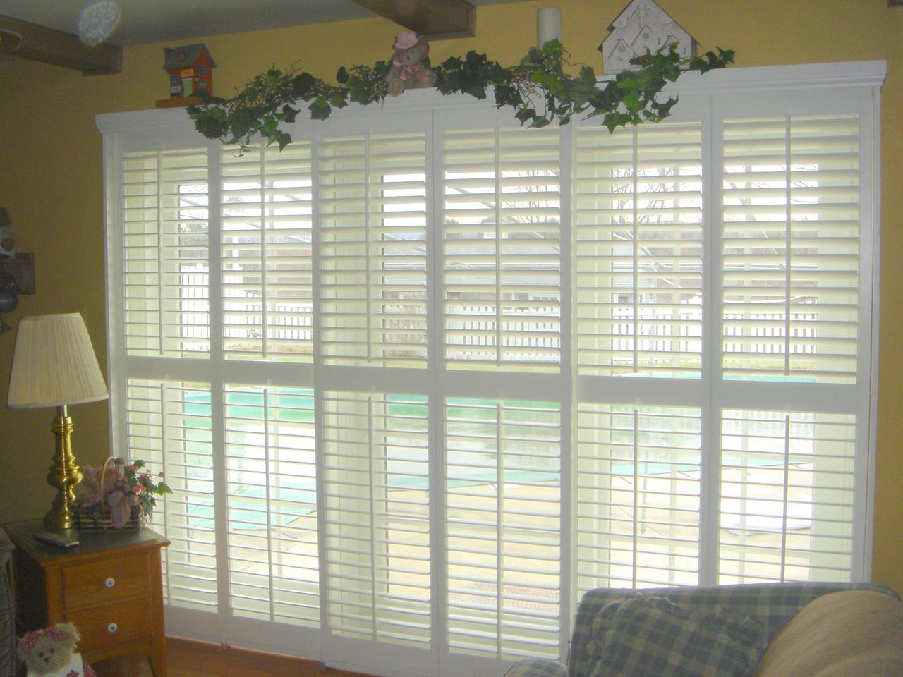 Bypass style shutters on a sliding glass door