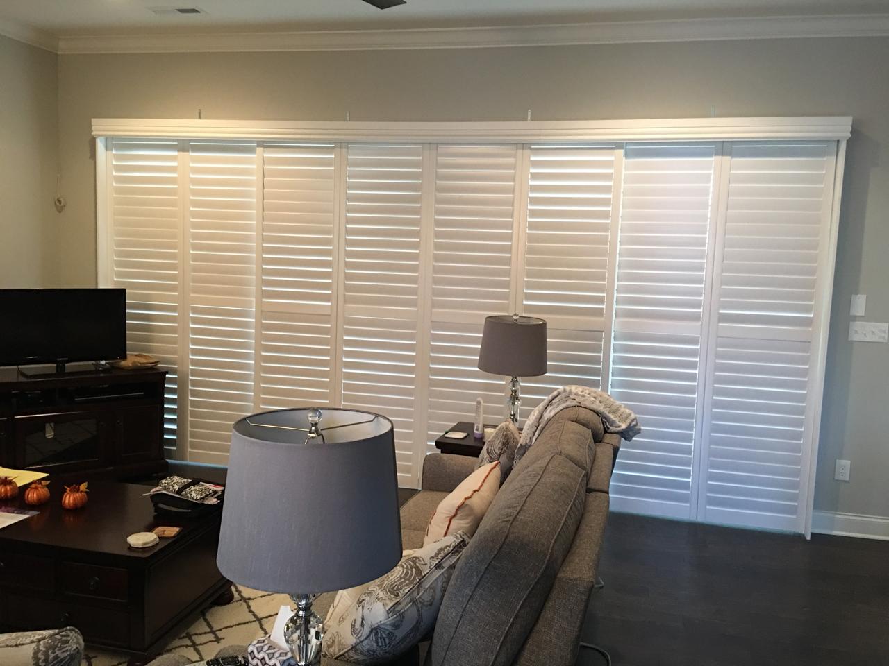 Bypass style plantation shutters on a sliding glass door