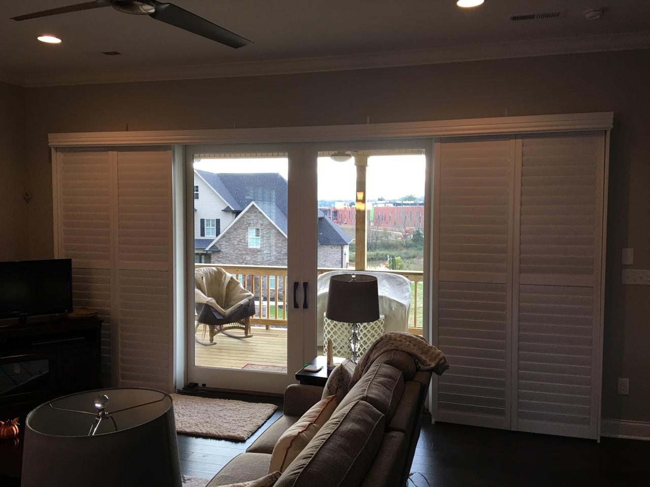 Bypass shutters opened on sliding glass door