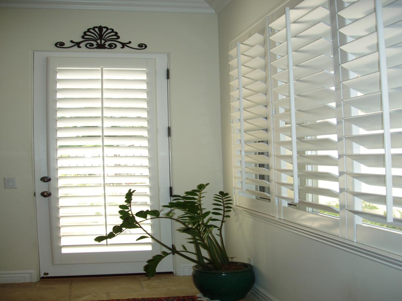 Glass door and windows with plantation shutters