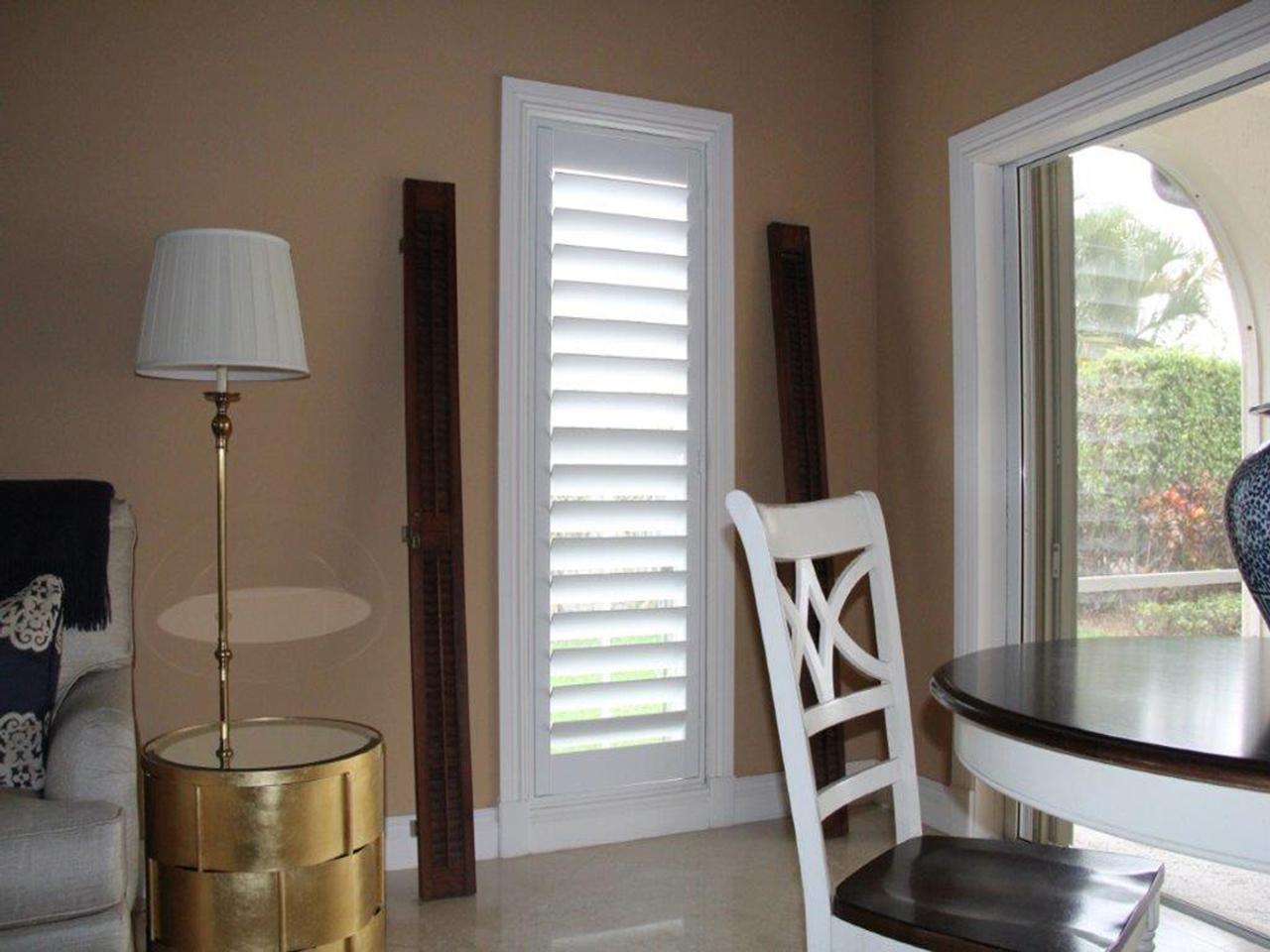 Window with interior shutters