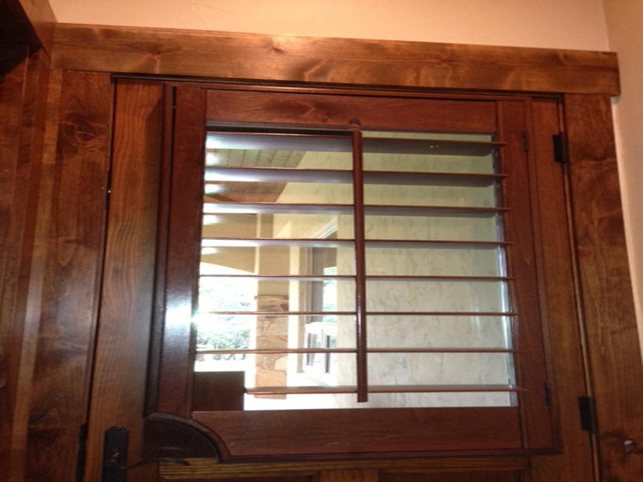 Stained shutters on a wood door