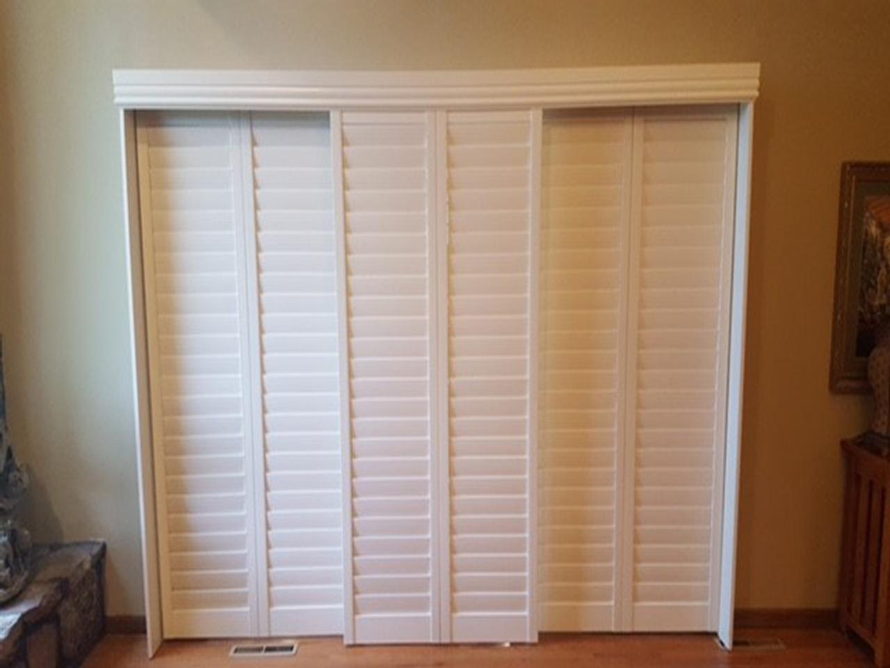 Bypass style interior shutters on sliding glass door