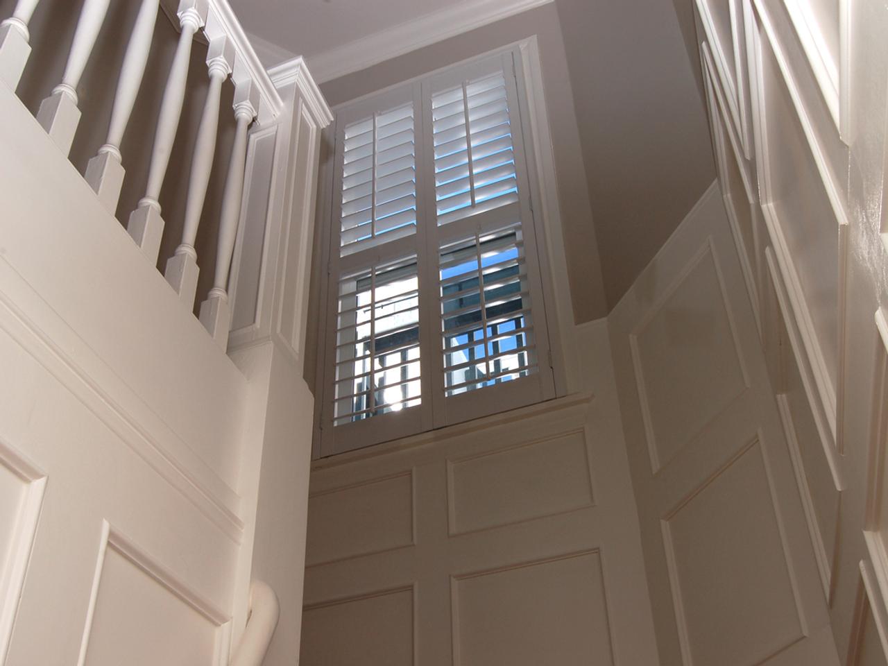 Interior shutters in a stairway