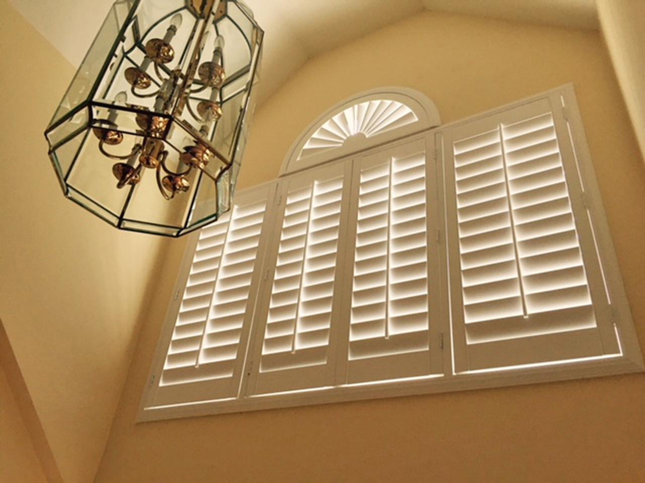 Sunburst and shutters in a two story foyer