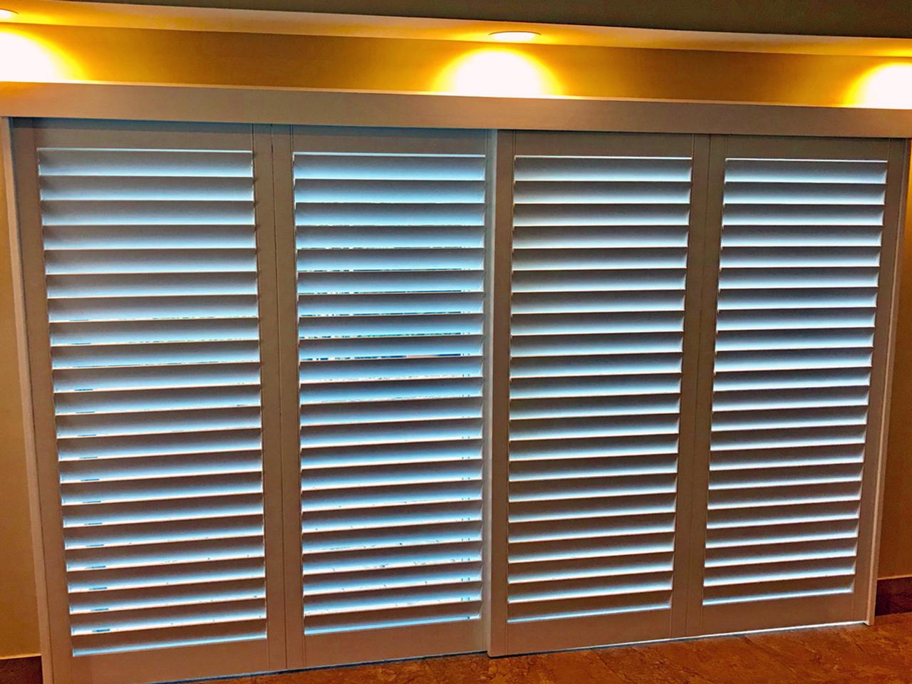Interior shutters on sliding glass doors with bypass option