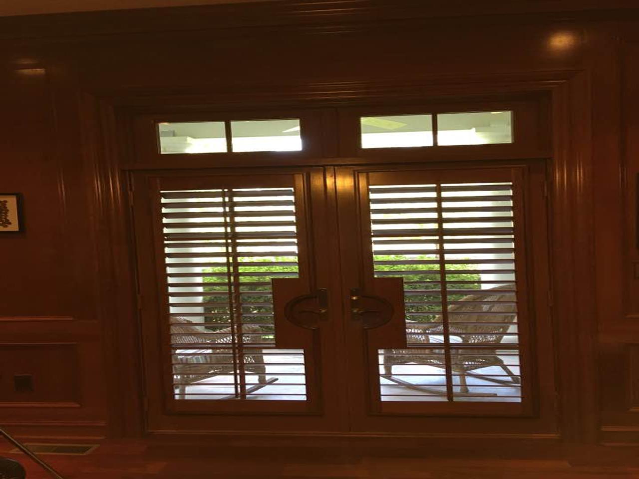 French doors with stained shutters