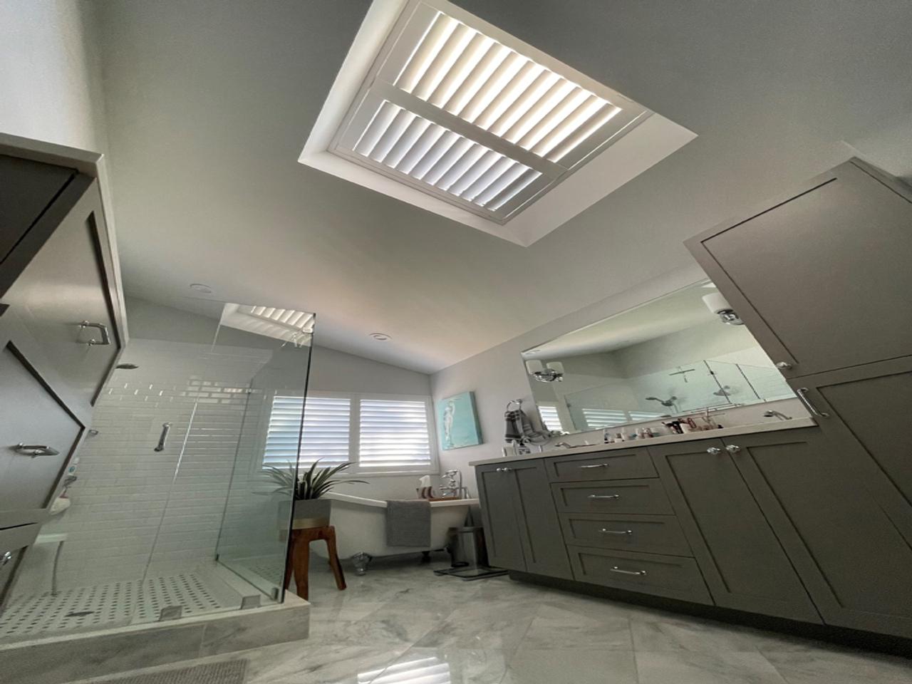 Shutters on skylight in bathroom